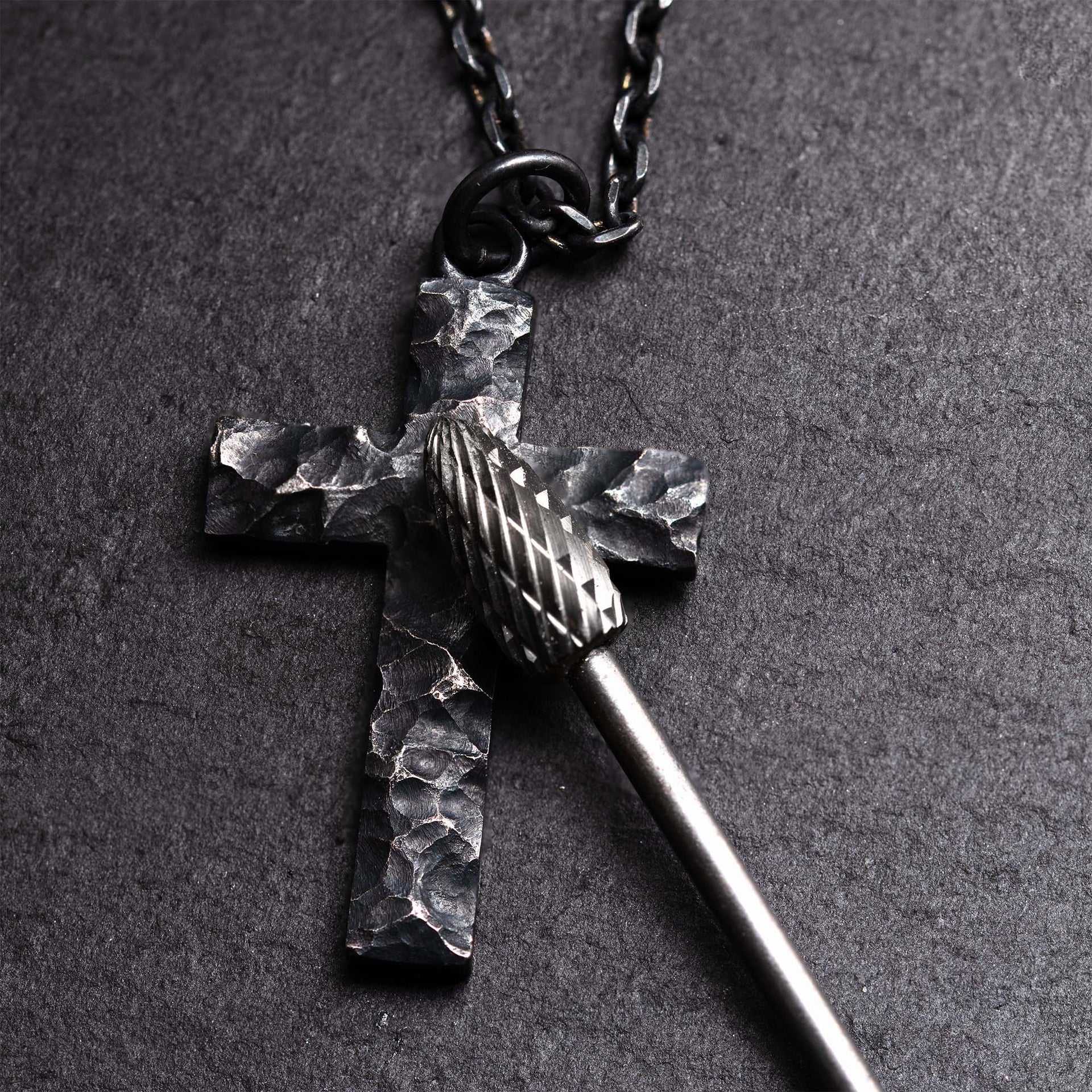 Handmade black silver cross jewelry for men with rugged surface detail