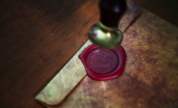 Eco-friendly jewelry packaging with custom wax-seal gift box.