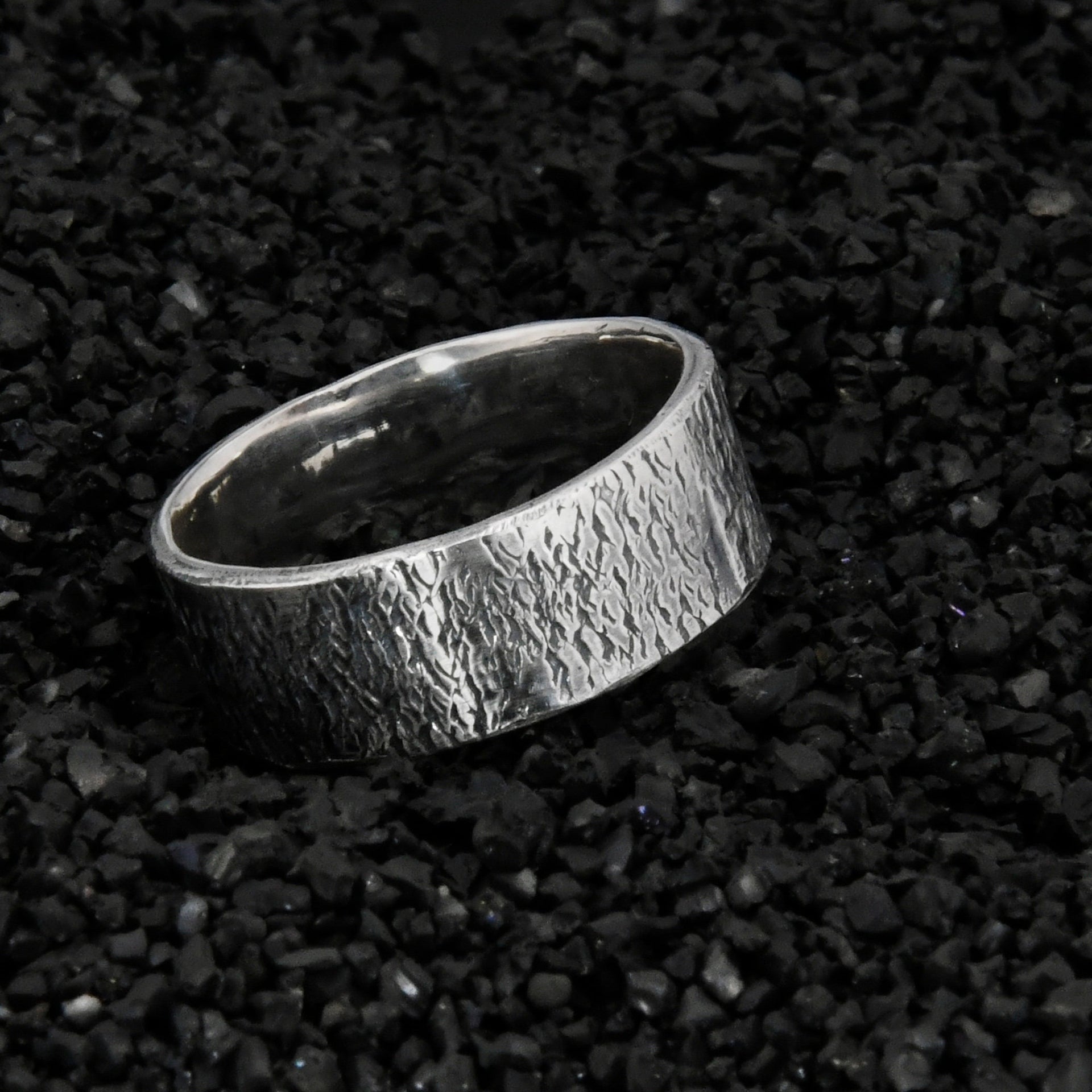 Close up of hand forged Celtic ring texture in oxidized silver