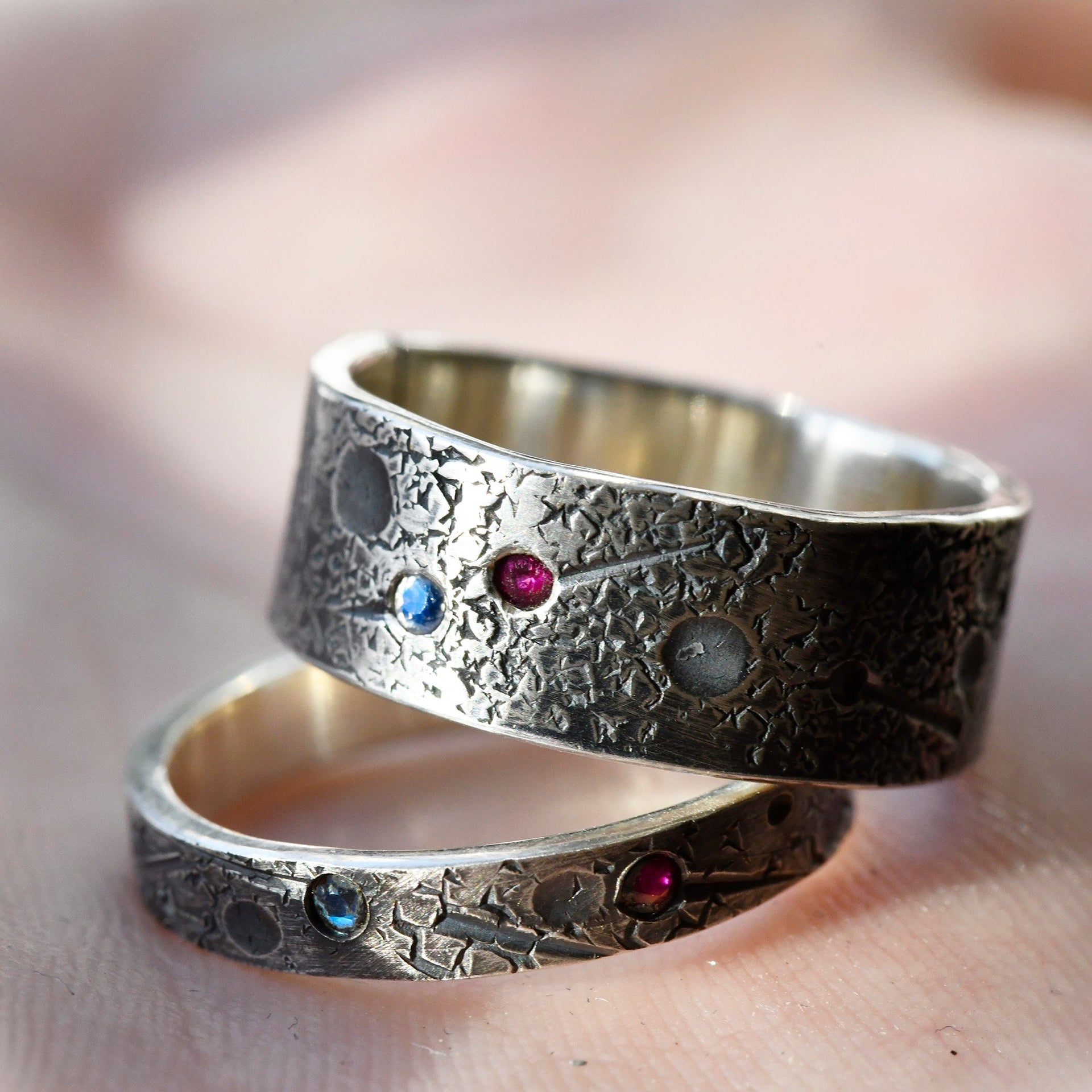 Birthstone ring set for two shown on hand for fit and gemstone detail