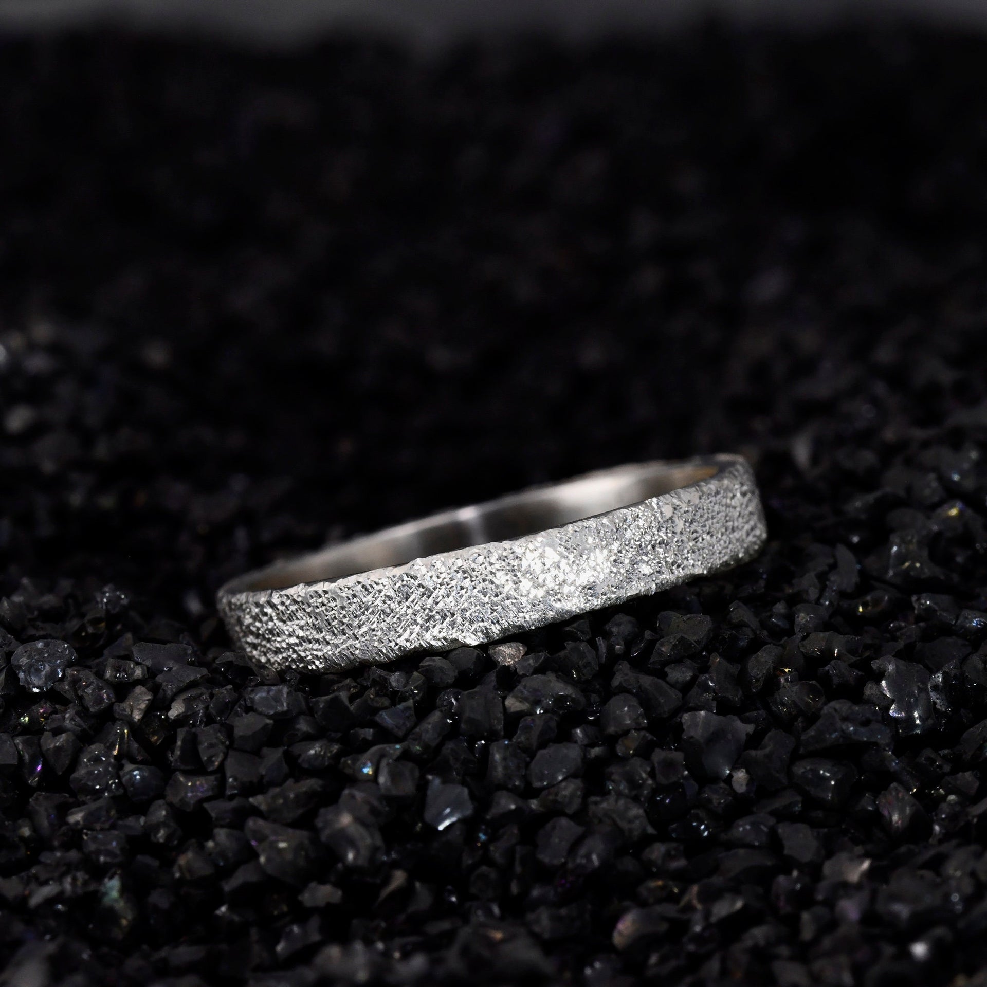 Close up of silver Gypsophila texture and polished ring edge