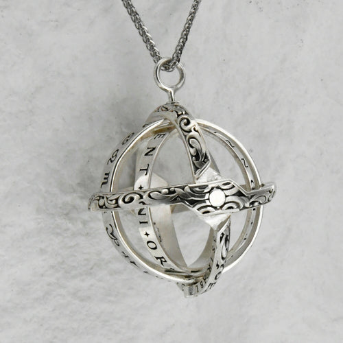 Open celestial sphere pendant necklace with custom birthstone detail