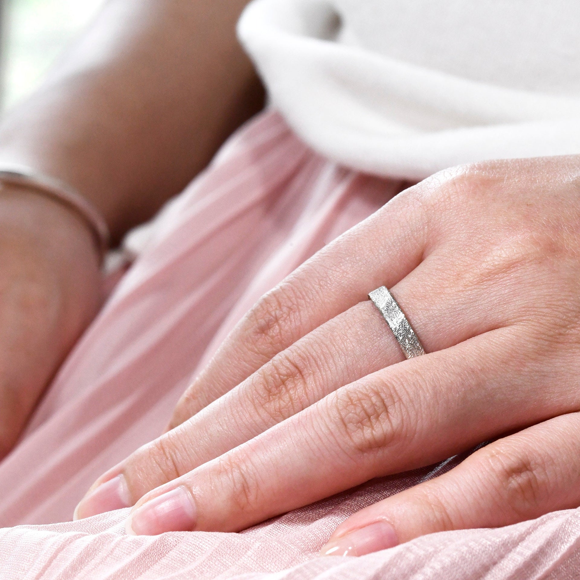 Dainty 4mm sterling silver ring with handmade light catching surface