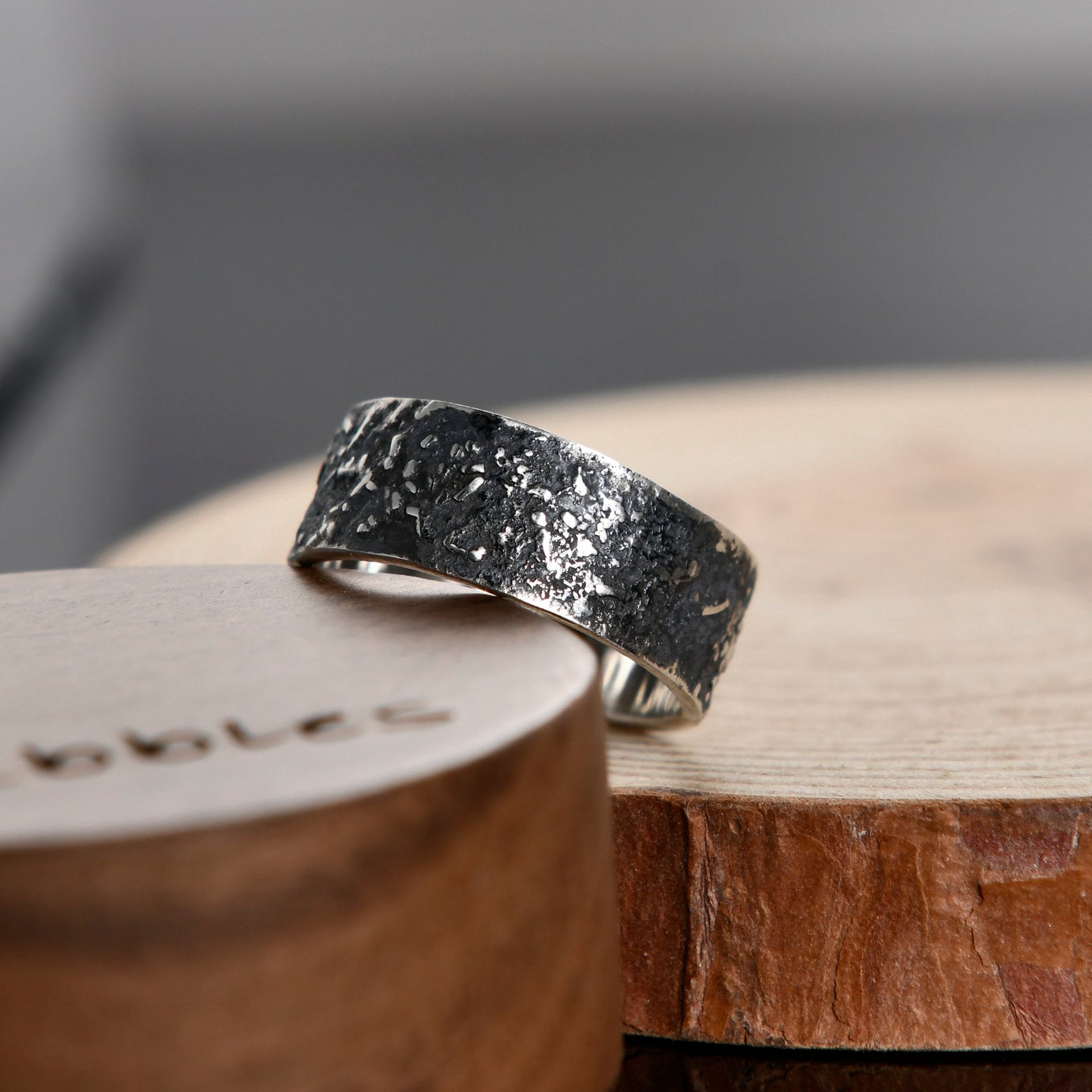 Handmade gunmetal grey silver ring with celestial-inspired texture for everyday wear.
