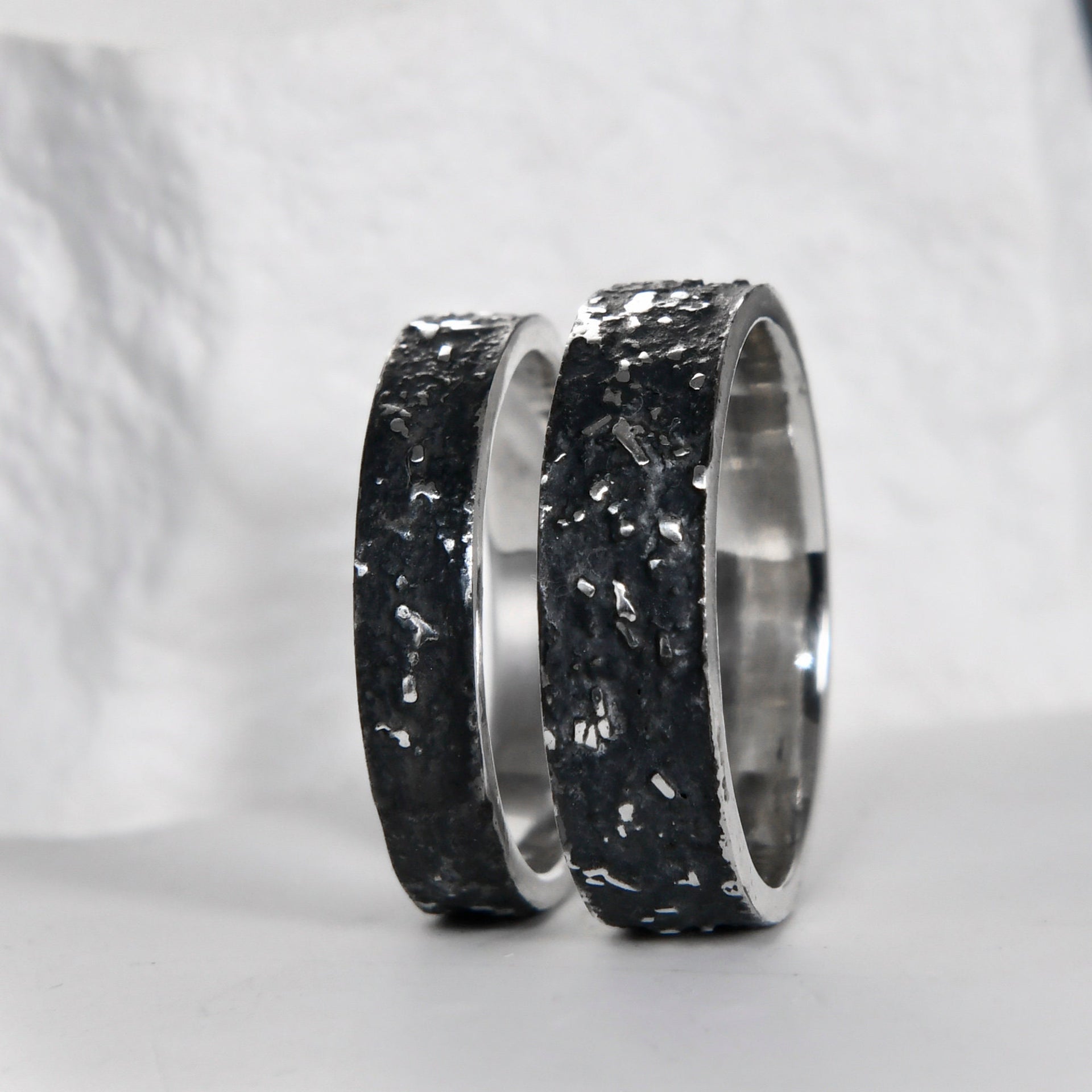 Side view of the gunmetal grey galaxy ring set with polished edges and handmade rustic texture.