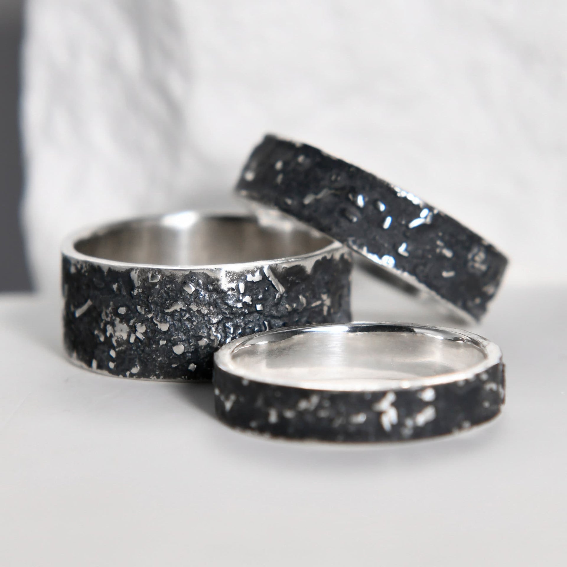 Detailed view of the oxidized silver surface and natural irregular pattern on the 4mm galaxy ring.