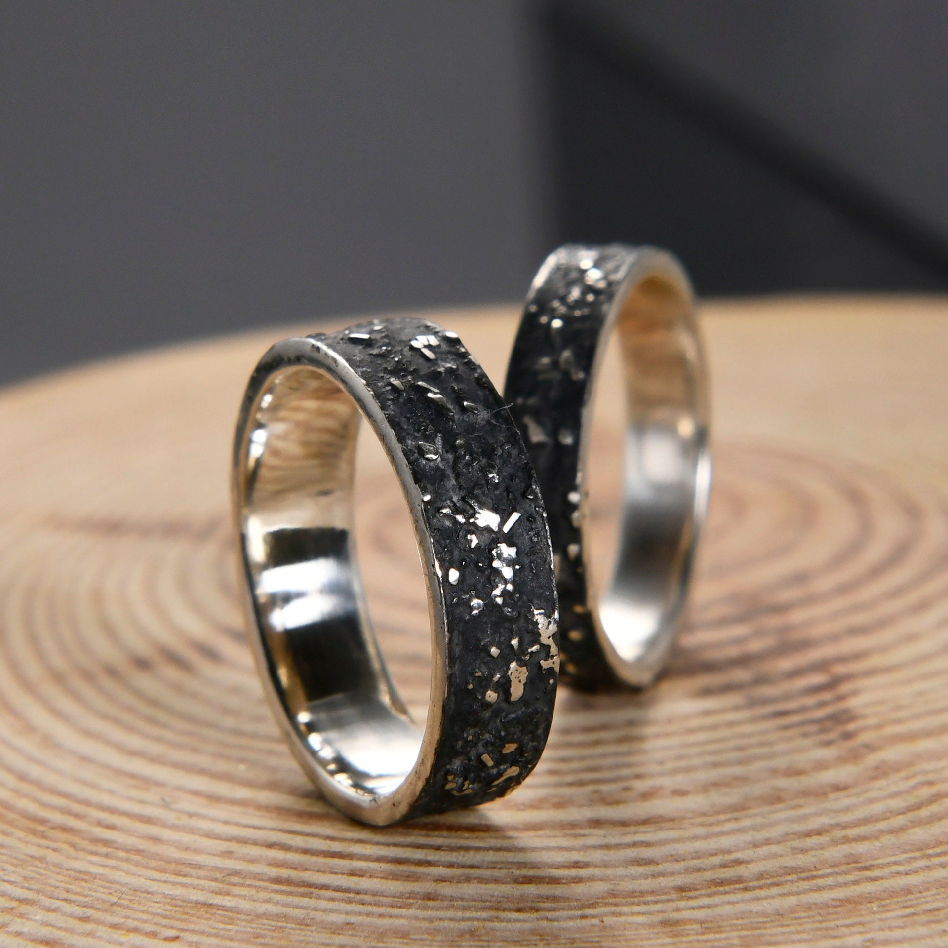 Matching silver galaxy ring set shown together as meaningful couple, promise, or wedding bands.