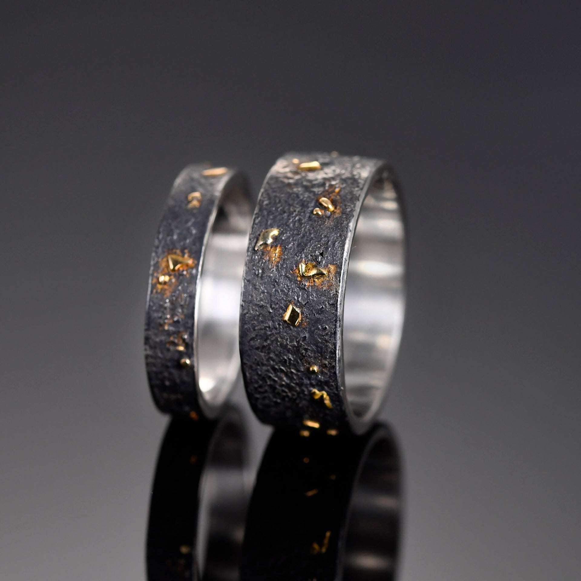 Black silver gold lava ring worn as meaningful everyday band