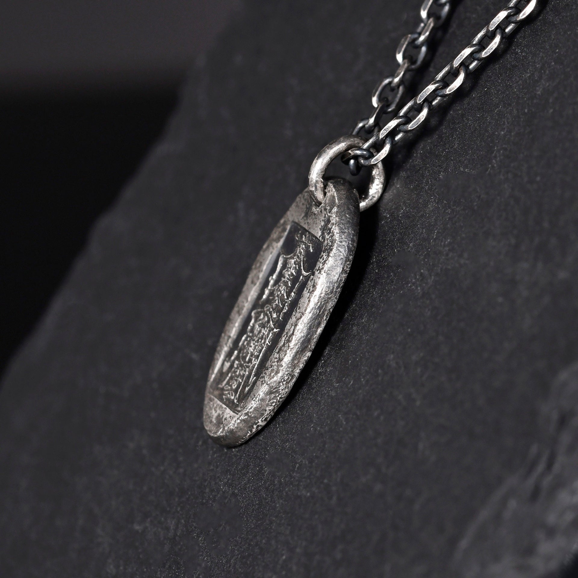 Fu Lu Shou amulet pendant shown close up in rustic silver finish