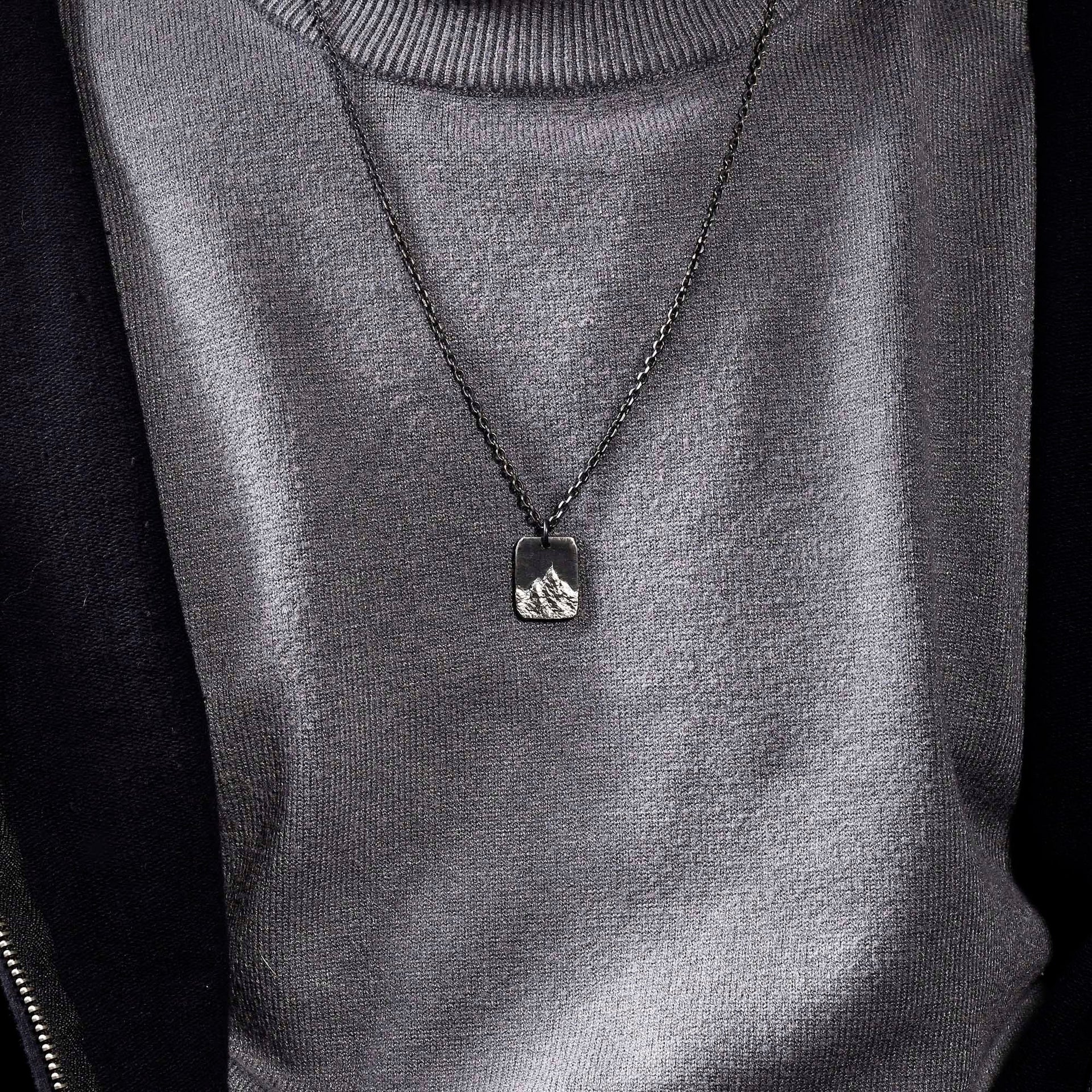 Dark oxidized silver rectangular mountain charm with rustic finish